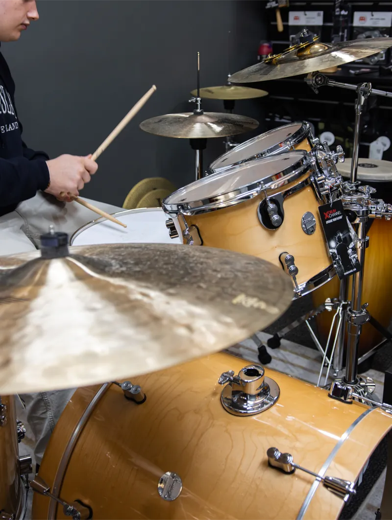 A drummer at a stage-ready kit