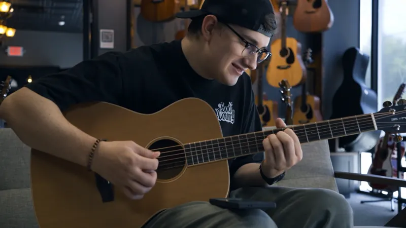A guitarist playing in the Corzic Music showroom