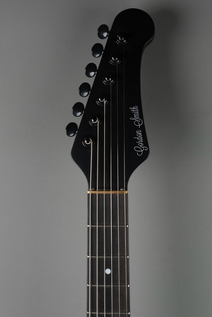 Griffin-jet-black-headstock-grey-background.jpg